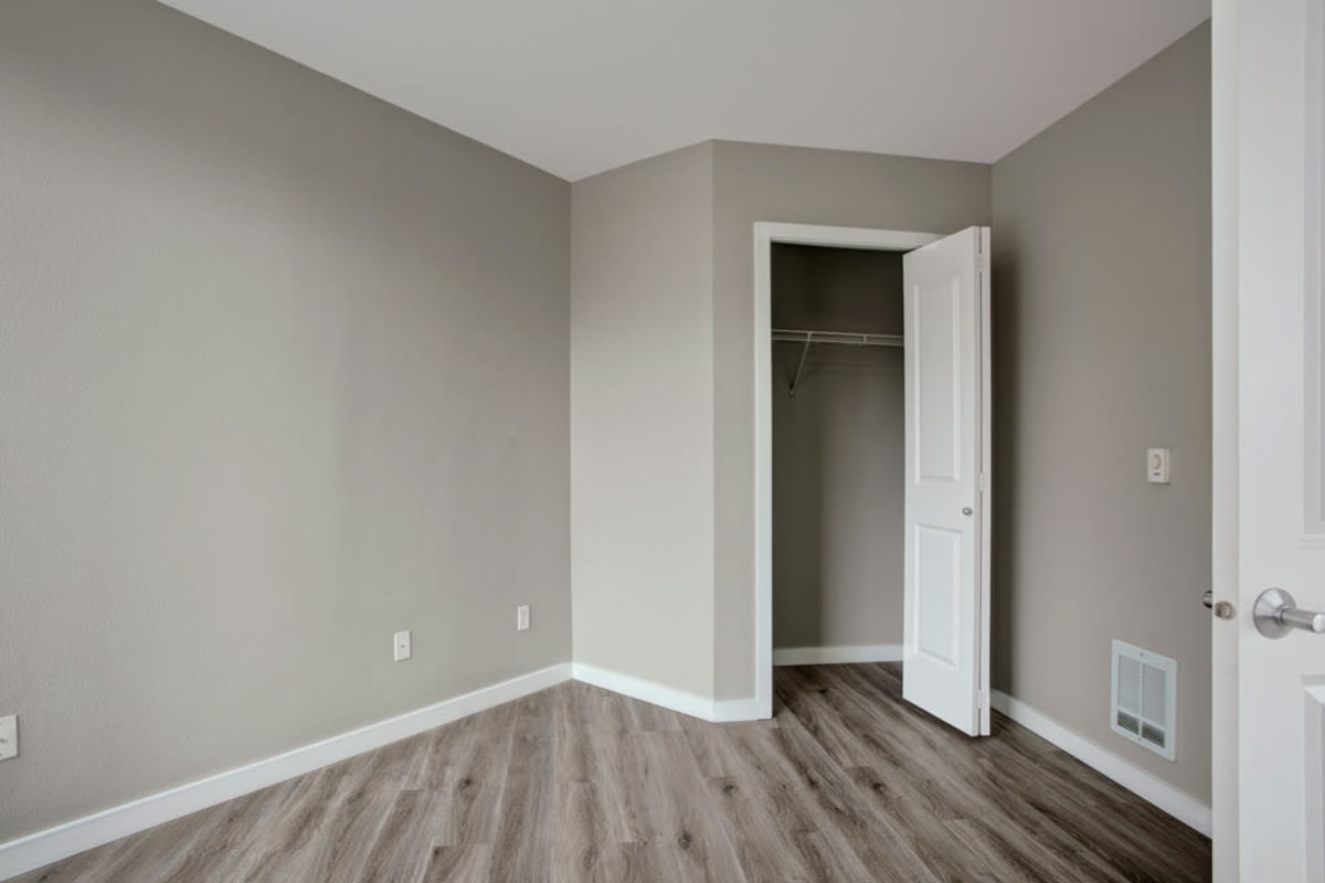 Antique-style hardwood flooring in a model apartment's bedroom at 700 Broadway in Seattle, Washington