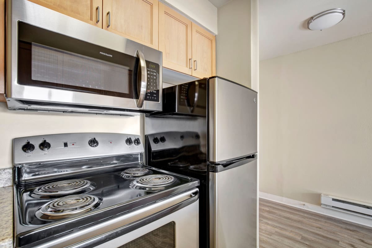 Sparkling stainless-steel appliances in a recently renovated apartment's kitchen at Vantage Park Apartments in Seattle, Washington