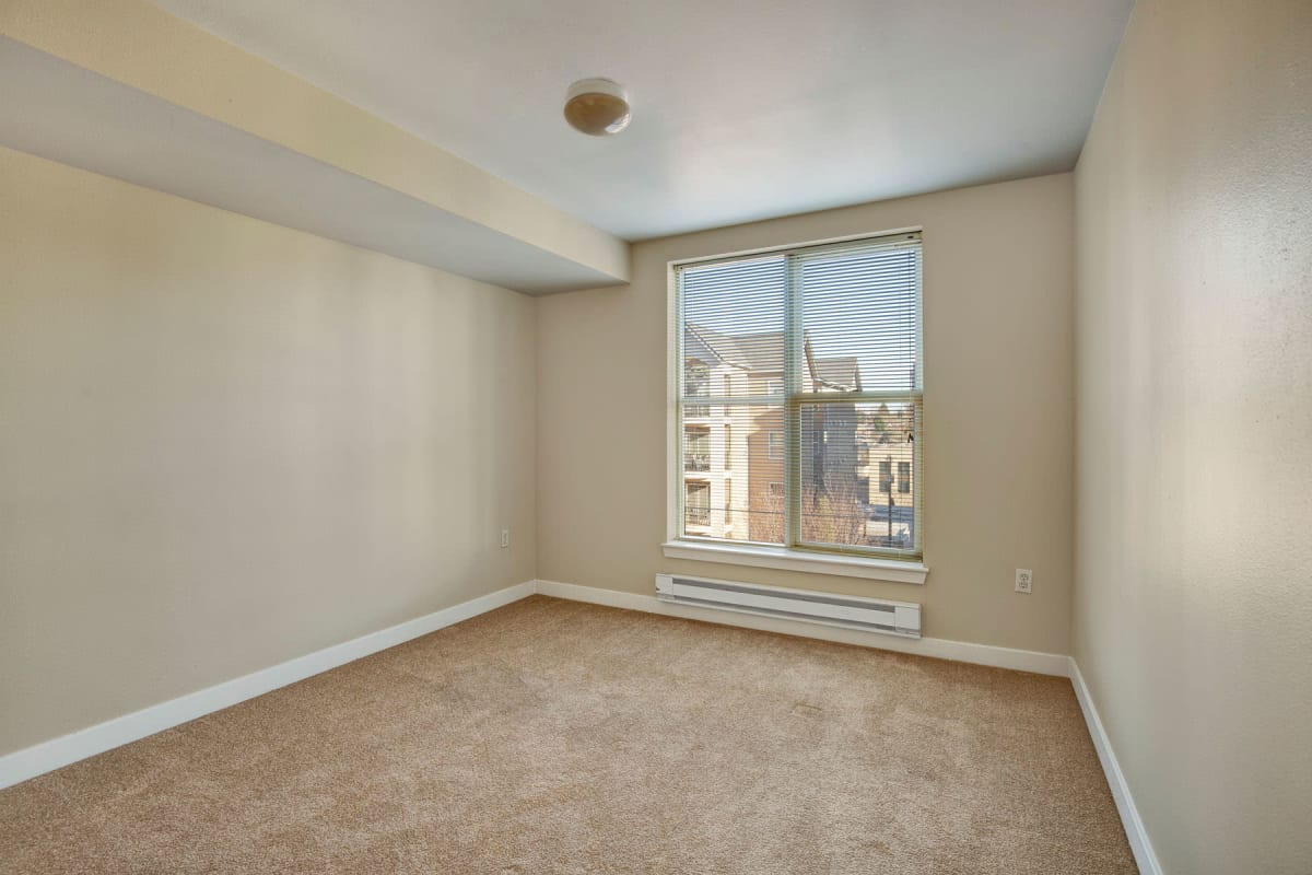 Plush carpeting and a terrific city view from an apartment's bedroom at Vantage Park Apartments in Seattle, Washington