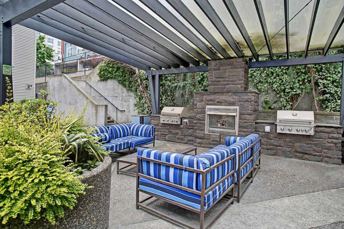 Pergola above an outdoor lounge area with a fireplace at Vantage Park Apartments in Seattle, Washington