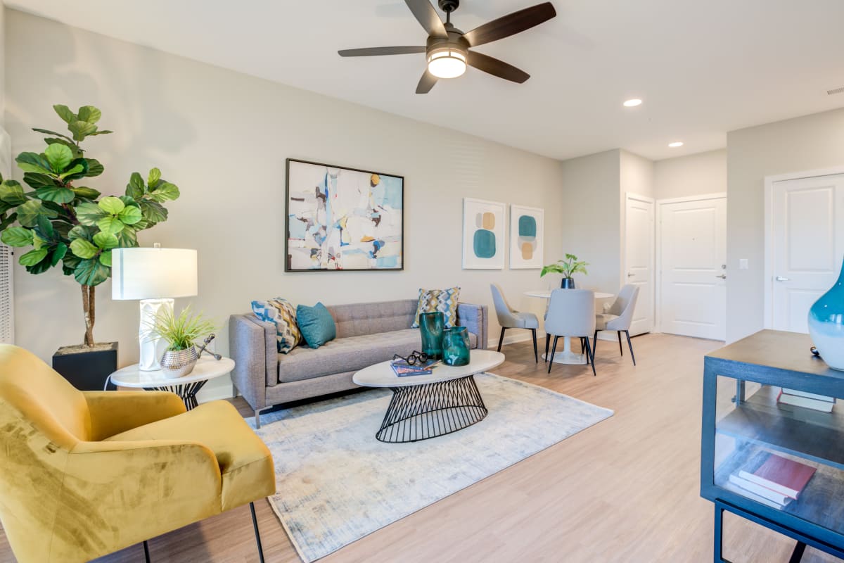 Well-furnished living space in a model apartment at The Pointe at Siena Ridge in Davenport, Florida