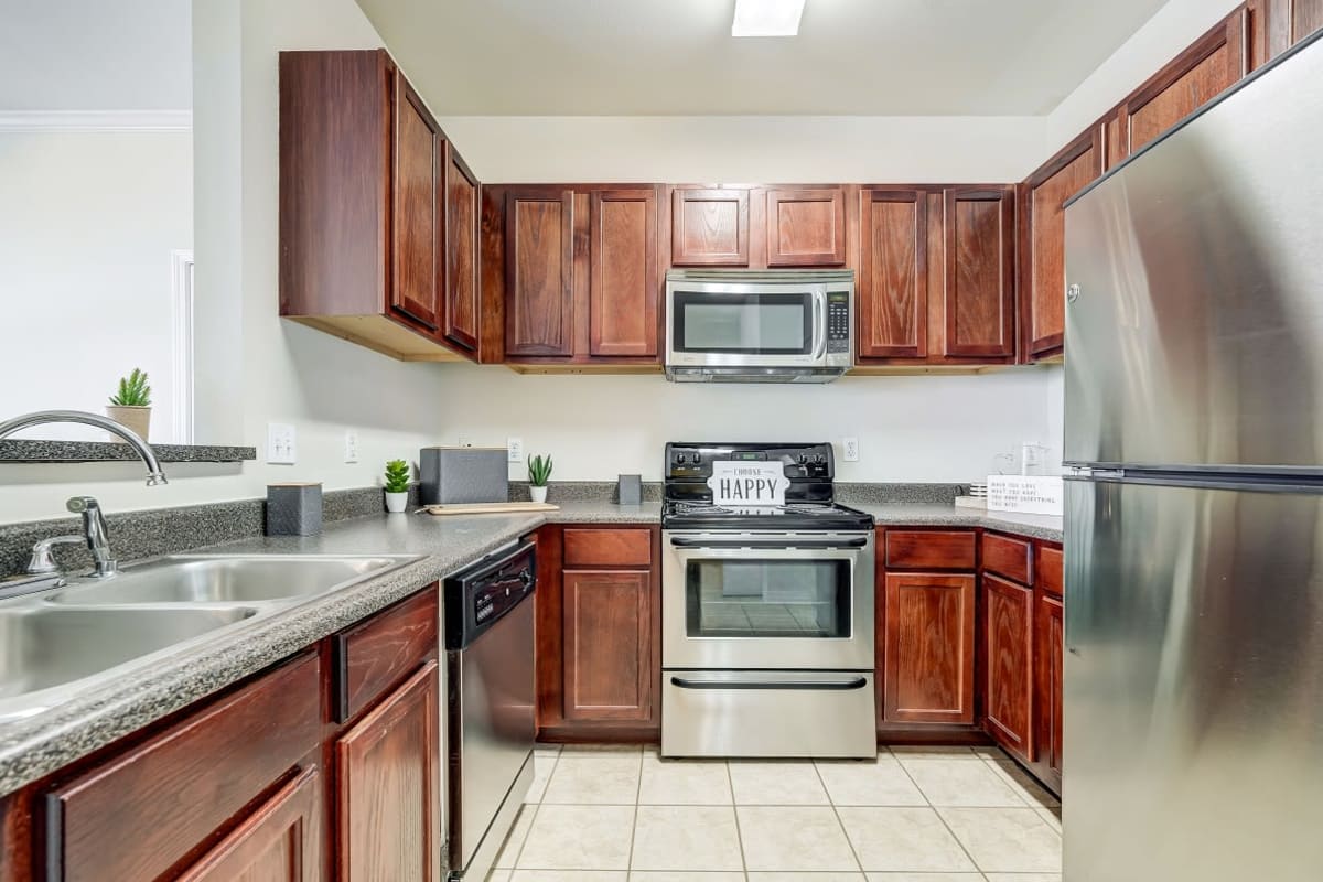 Fully stocked modern kitchen at Harborside Apartment Homes in Slidell, Louisiana