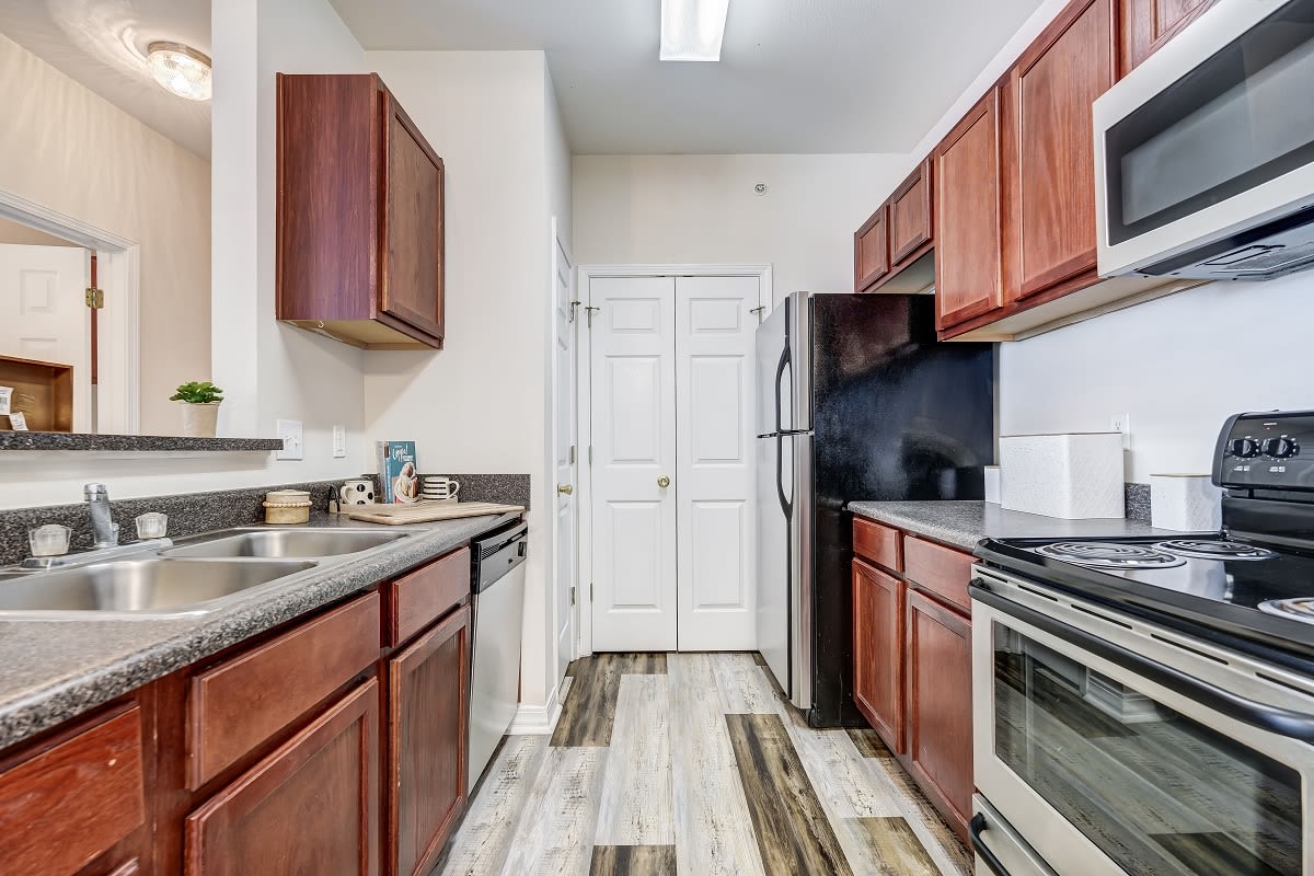 Fully stocked modern kitchen at Harborside Apartment Homes in Slidell, Louisiana