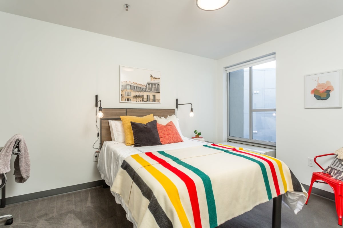 Spacious student bedroom in a model apartment at The Altitude in Harrisonburg, Virginia