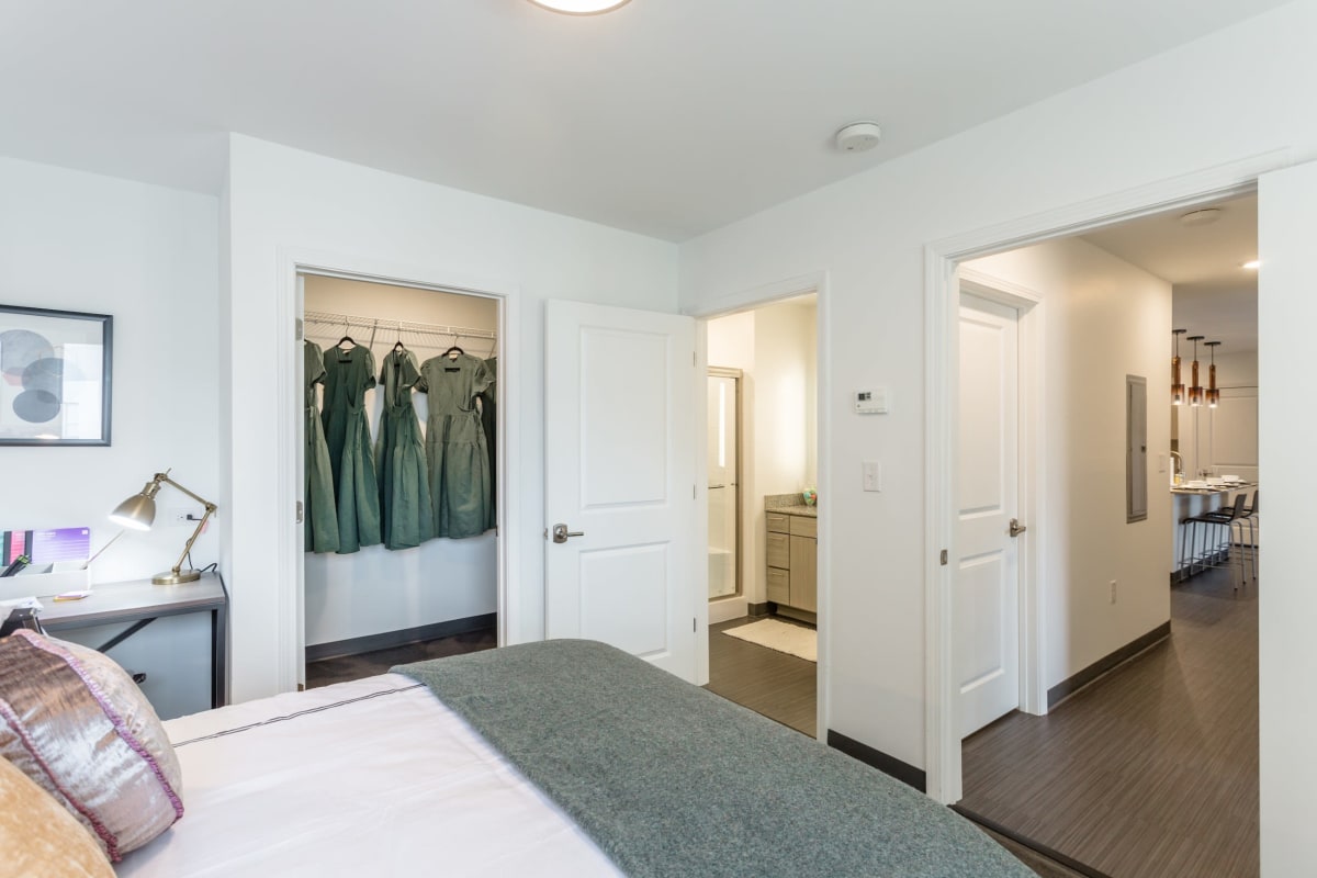 Model bedroom with a large closet and en suite bathroom at The Altitude in Harrisonburg, Virginia