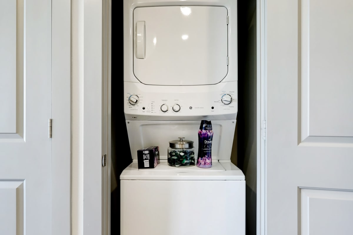 Stacked washer and dryer in an apartment at Tower 5040 in Houston, Texas