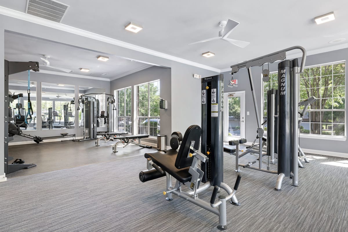 Elliptical machines facing television monitor in fitness room at Marquis of Carmel Valley in Charlotte, North Carolina