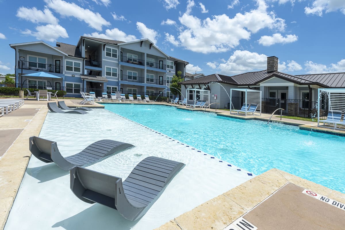 Poolside seating at Brazos Crossing in Richwood, Texas