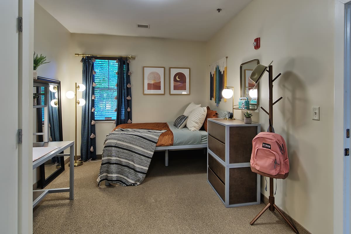 Bedroom with carpet at Twin River Commons in Binghamton, New York
