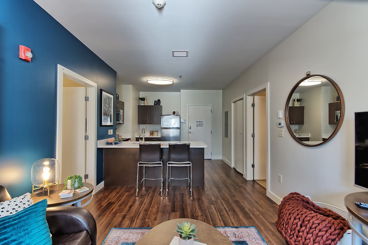 Spacious apartment with wood-style flooring at Twin River Commons in Binghamton, New York