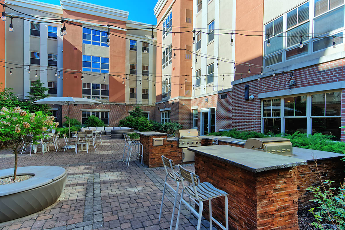 Courtyard with grilling stations at Twin River Commons in Binghamton, New York 