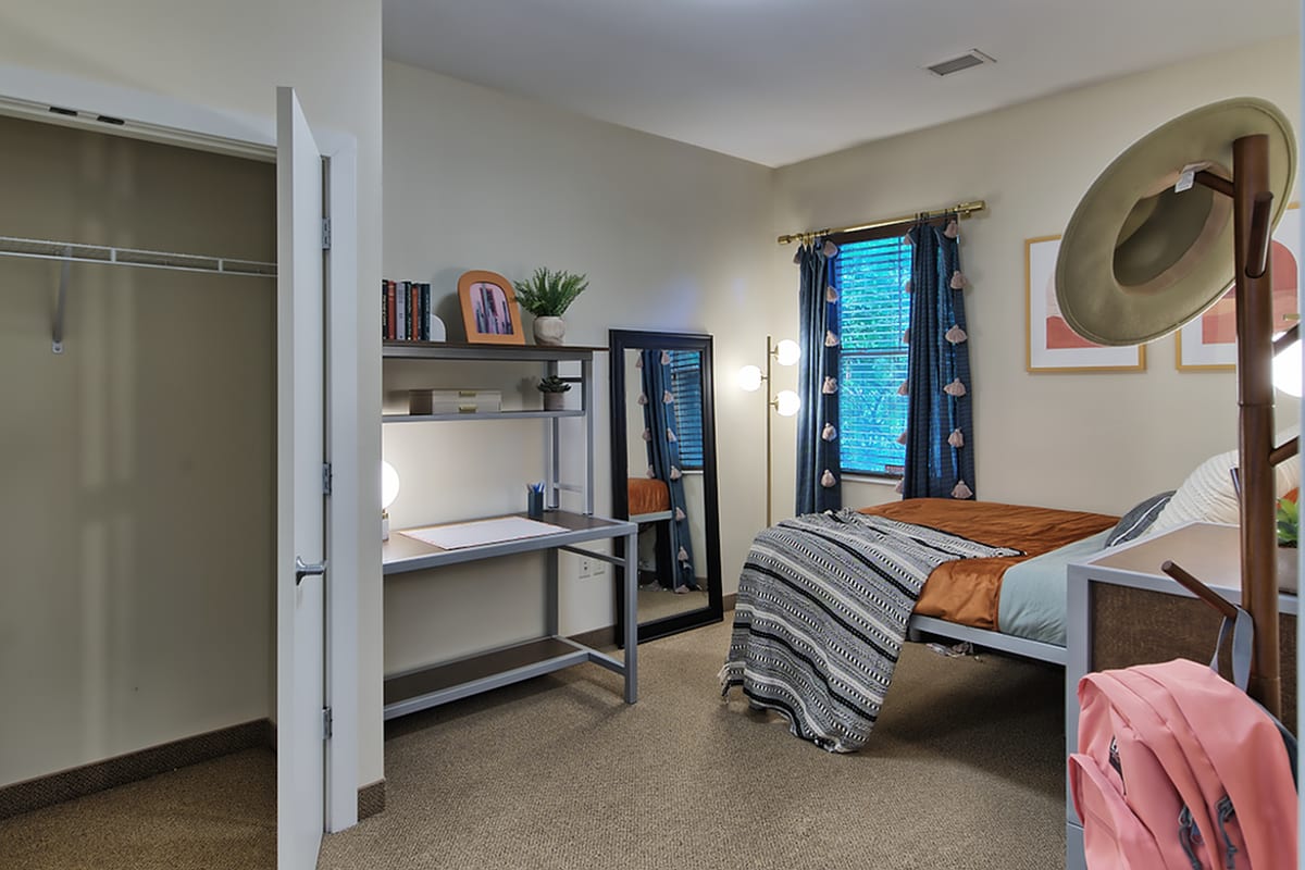 Bedroom with a large closet at Twin River Commons in Binghamton, New York