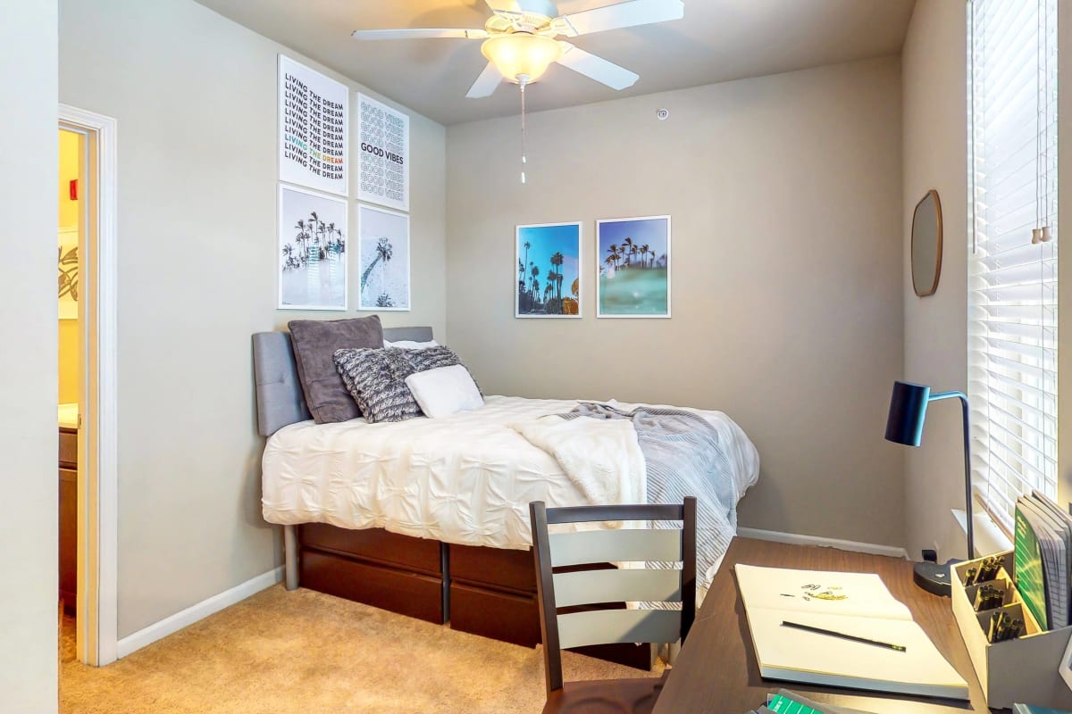 Spacious bedroom with desk at The Dillon in Bloomington, Indiana