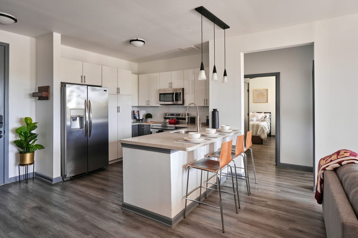 Sleek kitchen with stainless-steel appliances at The View on the Square in San Marcos, Texas