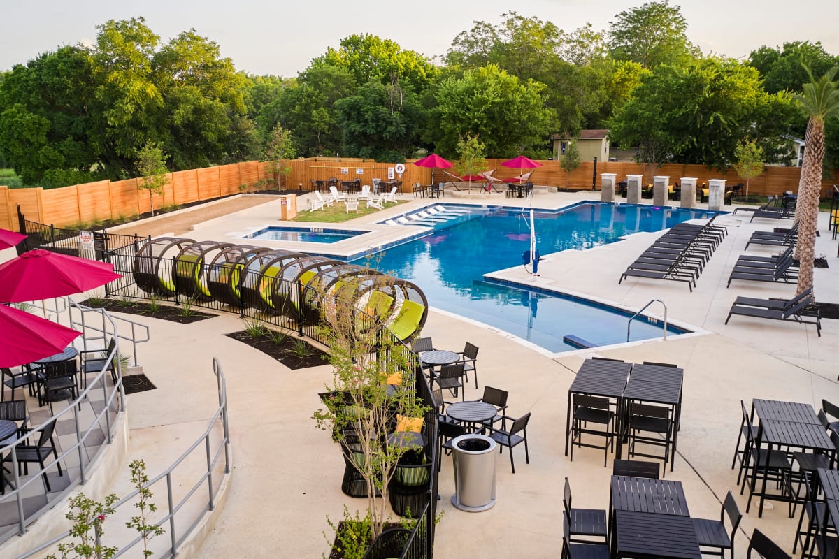 Pool and sun deck with lots of seating at The View on the Square in San Marcos, Texas
