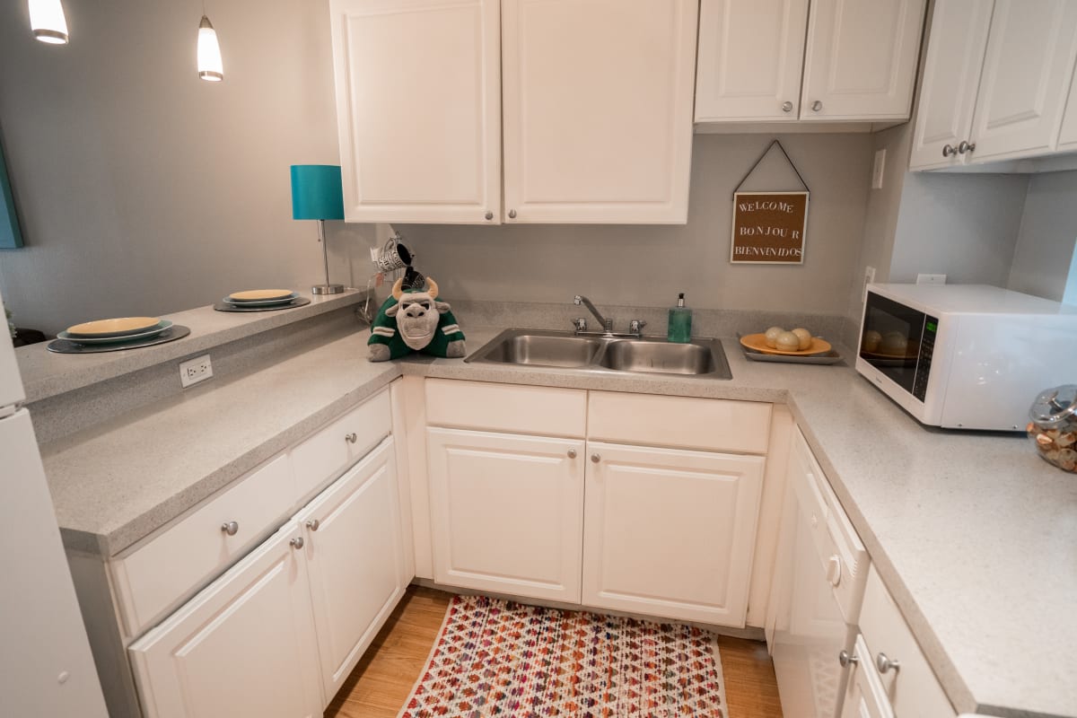 Kitchen with hardwood-style flooring at On50 in Tampa, Florida