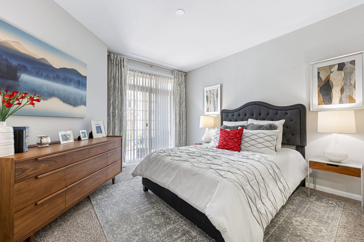 Bright bedroom with a large window at Marquis Castle Pines in Castle Pines, Colorado