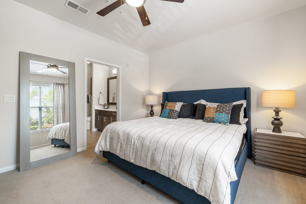 Bedroom with wood style flooring at Marquis at The Woodlands in Spring, Texas 