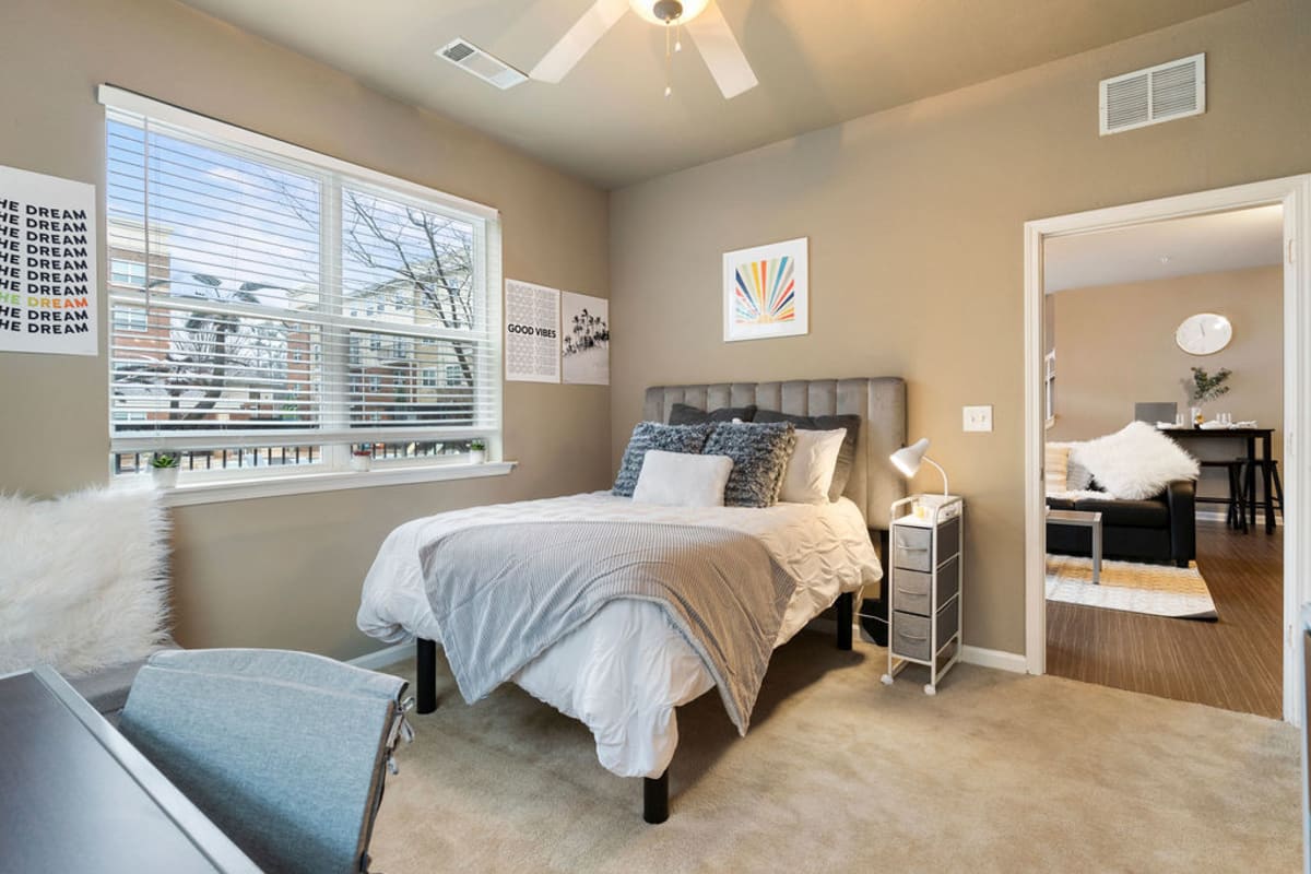 Bedroom with large windows off the living room at The Blake in Kennesaw, Georgia