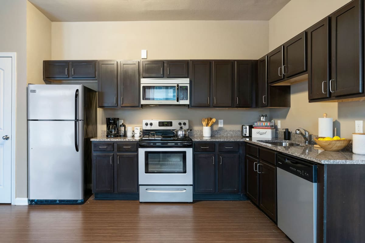 Kitchen with stainless-steel appliances at The Blake in Kennesaw, Georgia