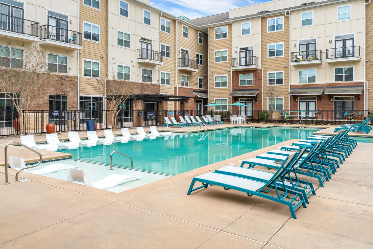 Sparkling pool with lots of lounge chairs at The Blake in Kennesaw, Georgia