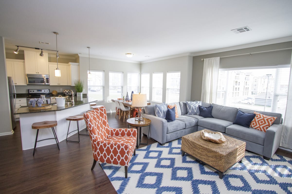 Living room with lots of natural light at The Residences at New Longview in Lees Summit, Missouri