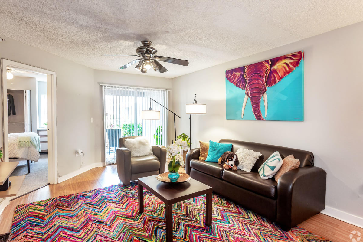 Model living room with a balcony in a student apartment at On50 in Tampa, Florida