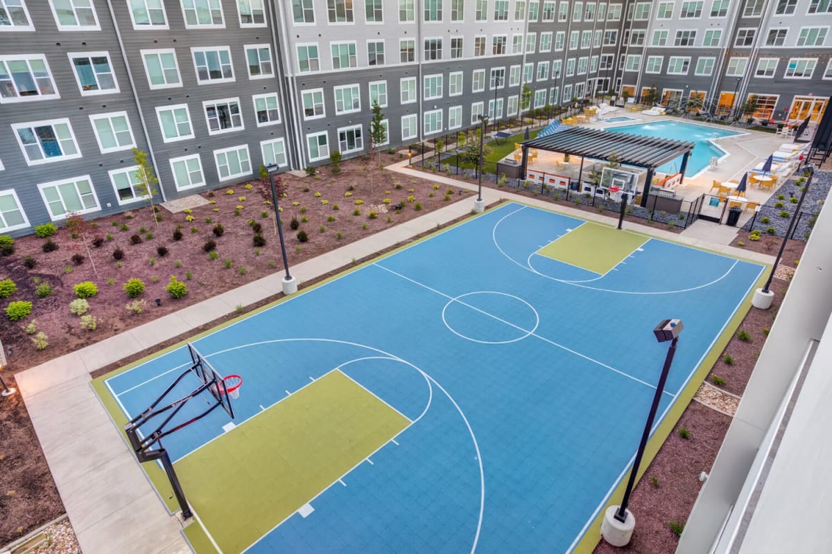 A large community basketball court at The Banks Student Living in Coralville, Iowa