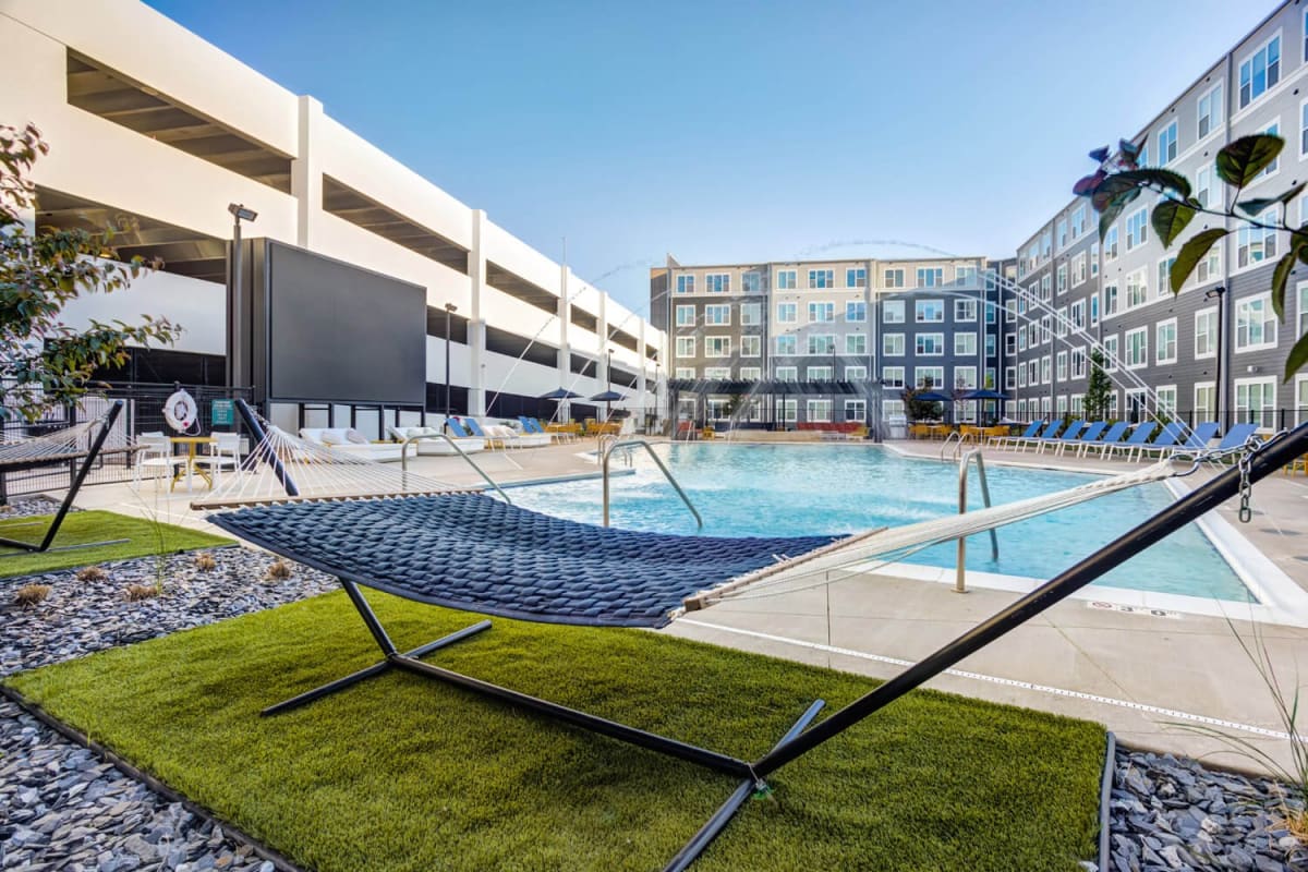 Hammocks around the community pool at The Banks Student Living in Coralville, Iowa