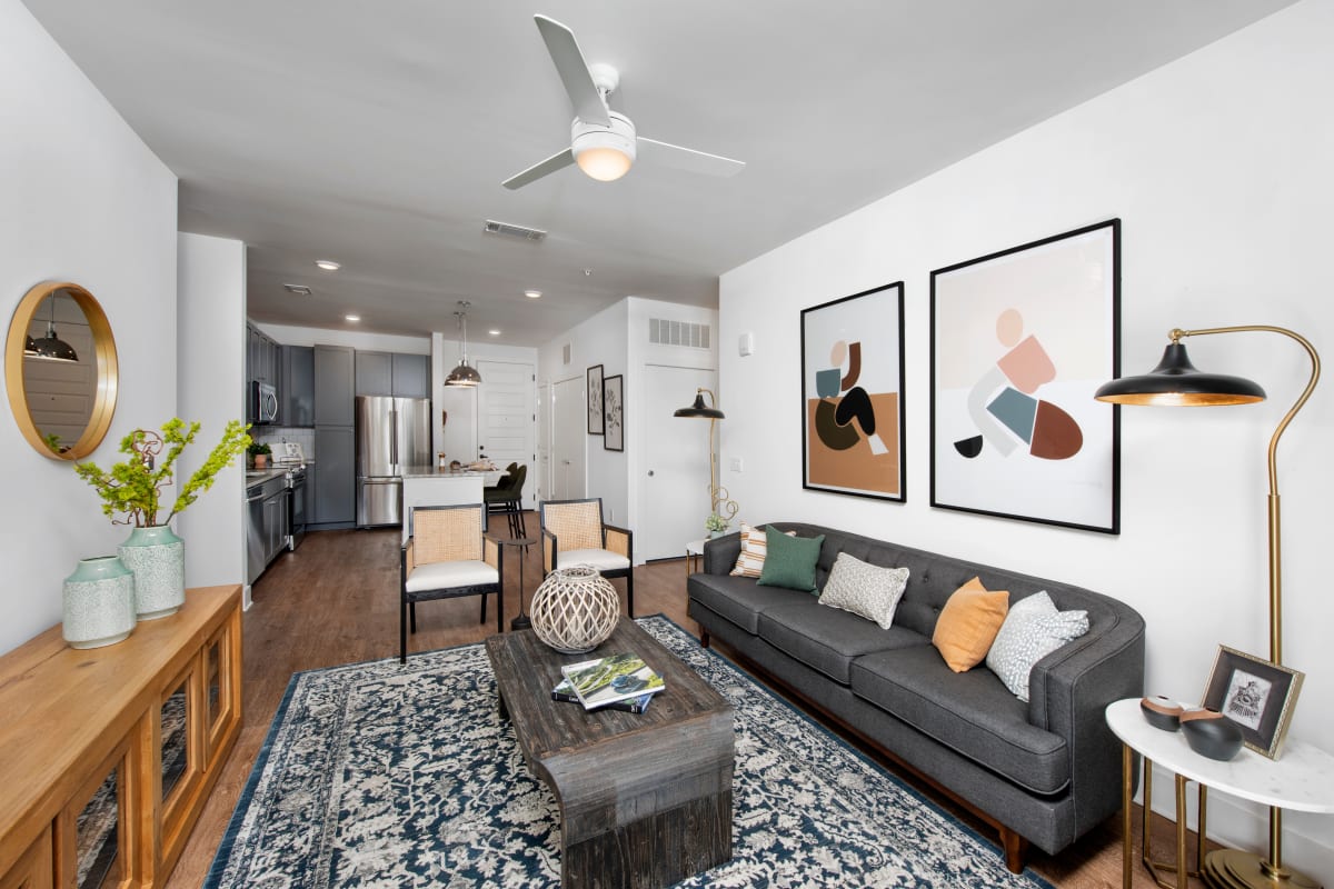 Model living room with wood flooring at The Brunswick in Norcross, Georgia