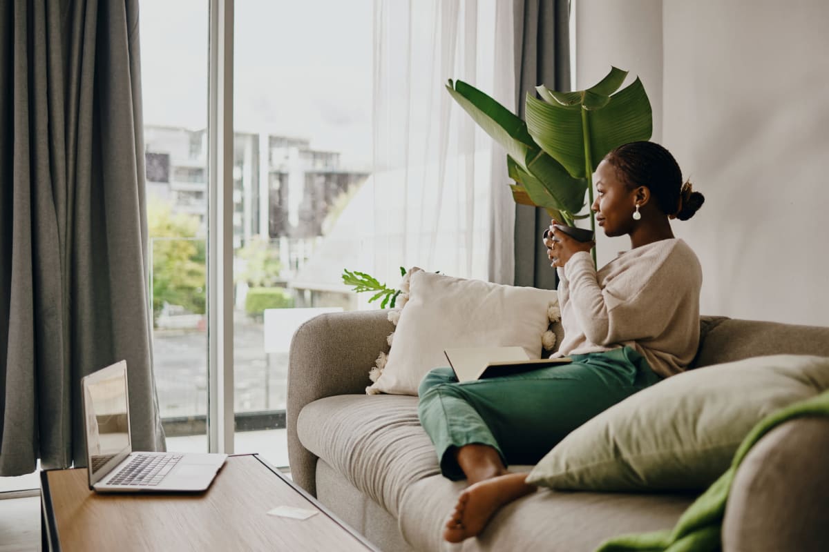 A resident relaxing on a couch at Integra Heights in Clermont, Florida