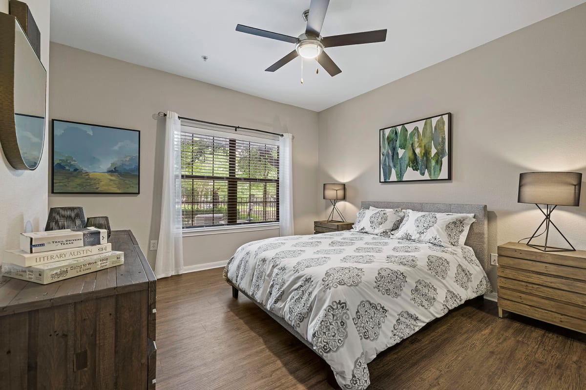 Bedroom with wood style flooring at Marquis Parkside in Austin, Texas 