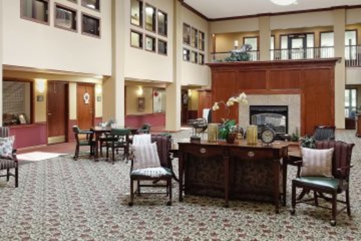 Lobby with seating and fireplace at Trustwell Living of Raytown in Raytown, Missouri