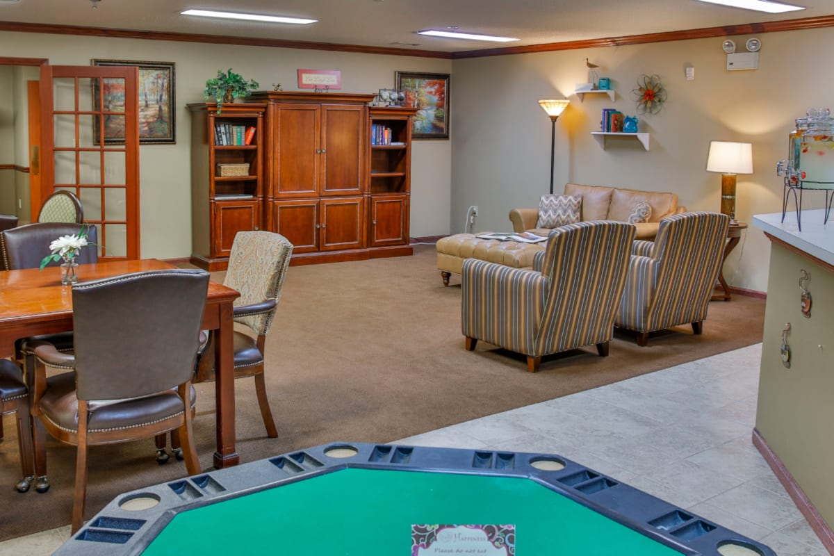 Recreation room with card table and entertainment center at Trustwell Living of Springfield in Springfield, Illinois