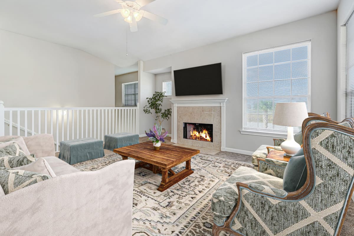 Upstairs living room with fireplace at Chateau des Lions Apartment Homes in Lafayette, Louisiana