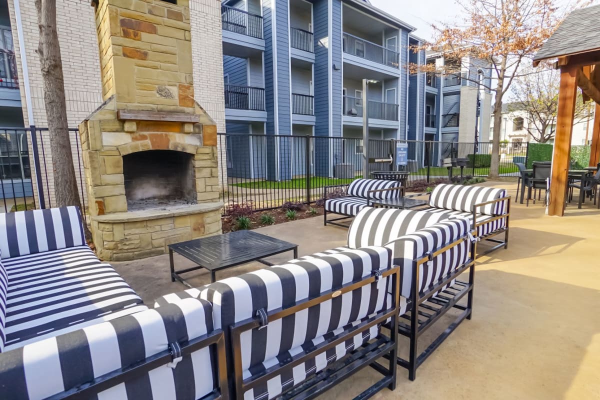 Outdoor fire pit with cozy seating at The Leonard in Denton, Texas