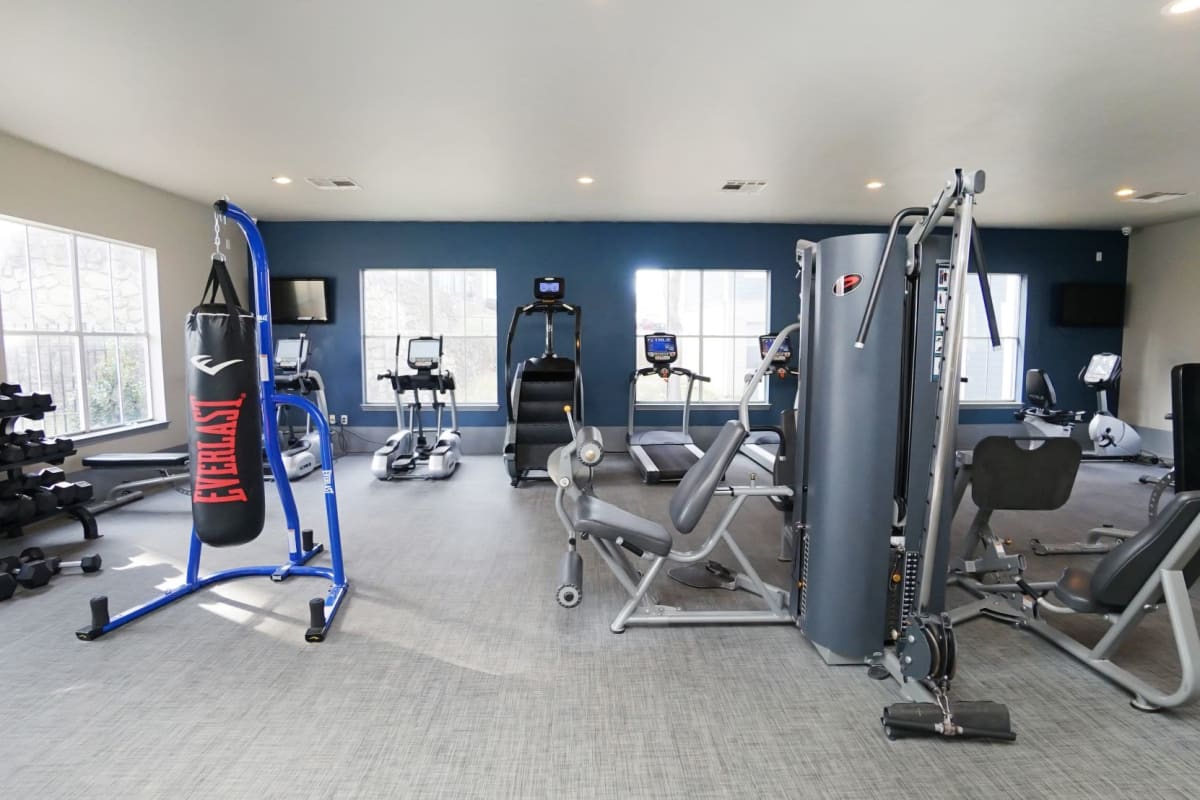 Plenty of free weights and a boxing bag in the fitness center at The Leonard in Denton, Texas