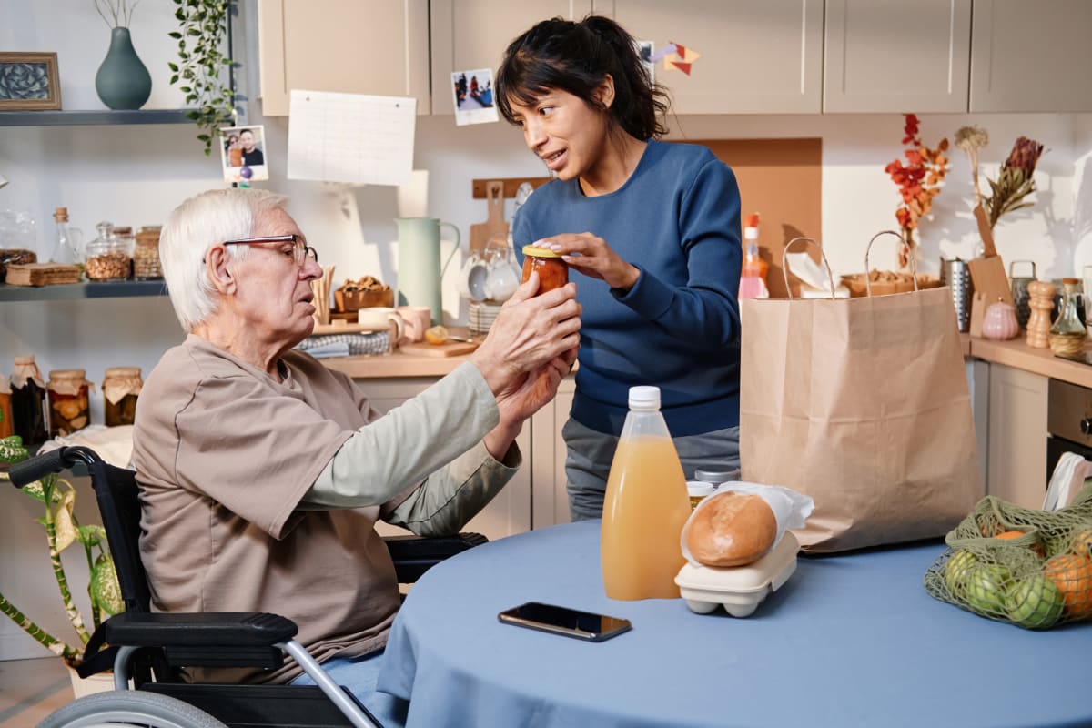 Caregiver assisting resident at Trustwell Living in New York, New York