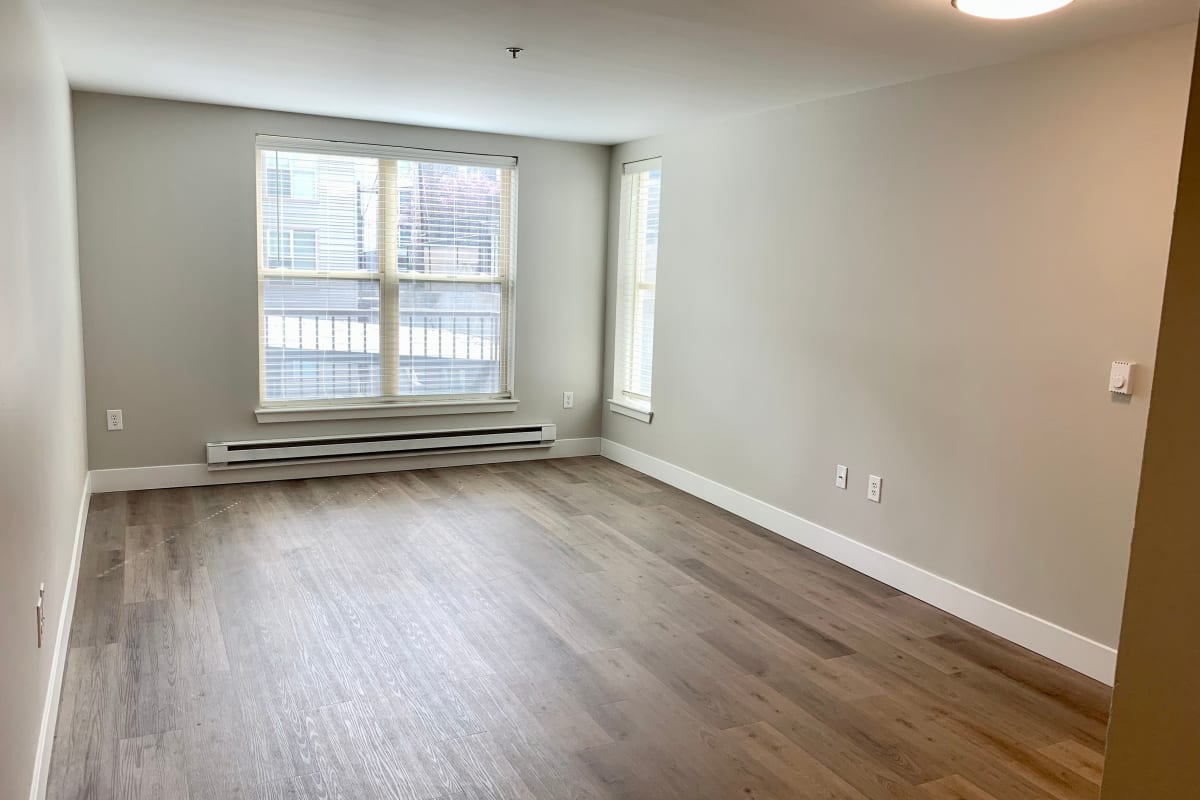 Spacious room facing window at Vantage Park Apartments in Seattle, Washington