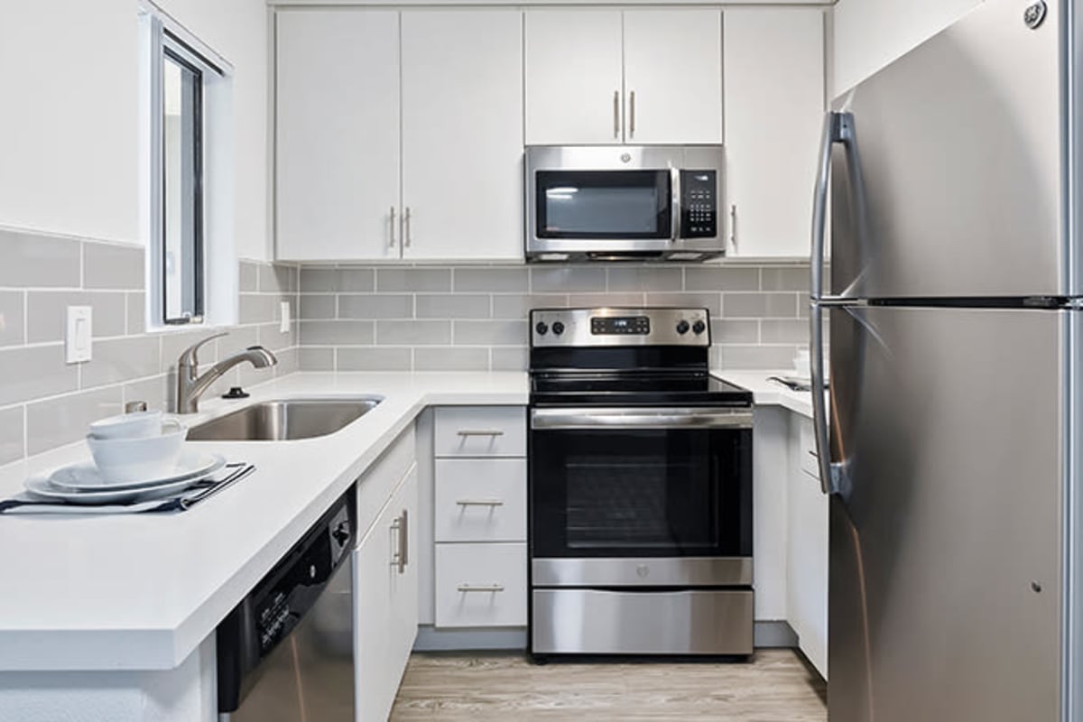 Modern kitchen with stainless-steel appliances at Alura in Woodland Hills, California