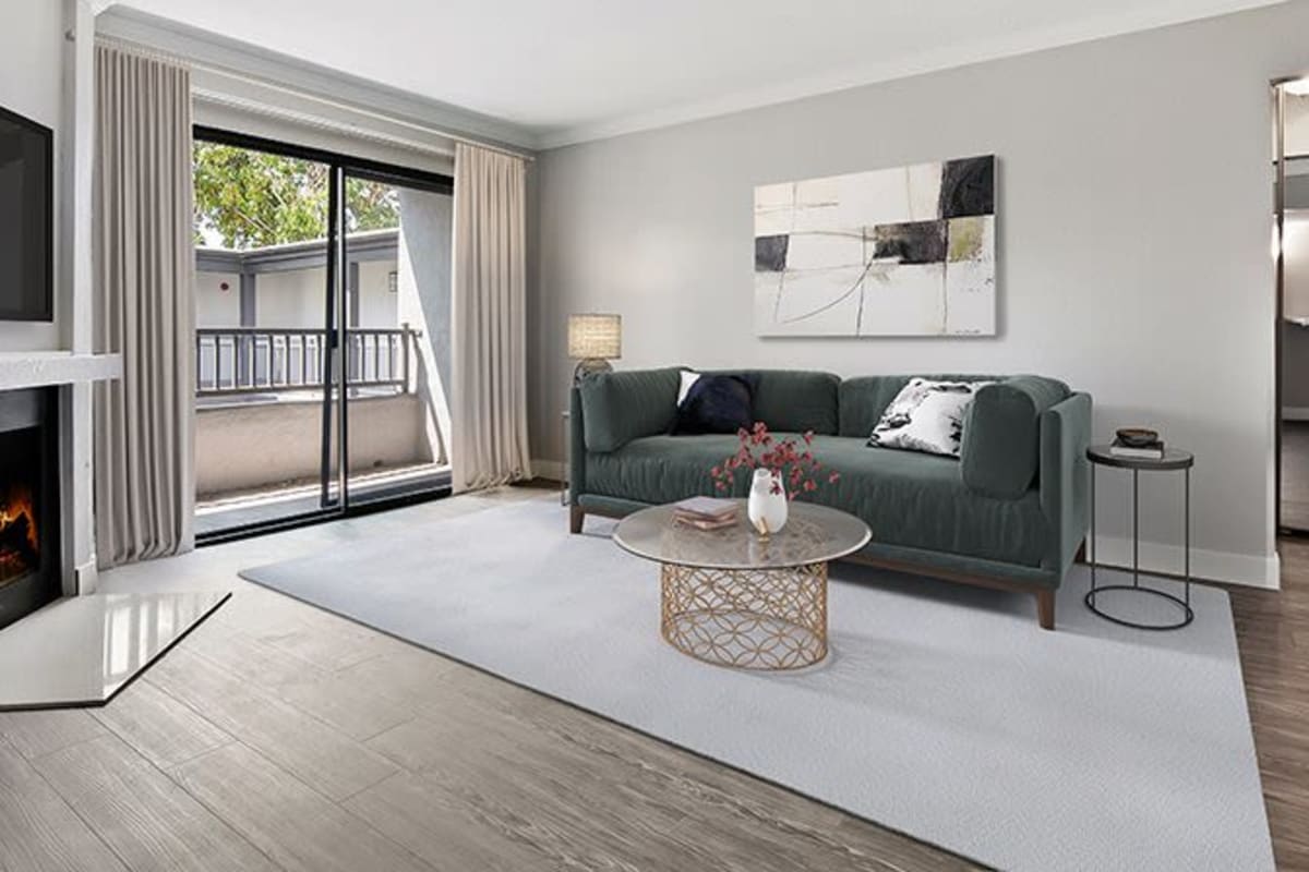 Living room with cozy fireplace at Alura in Woodland Hills, California