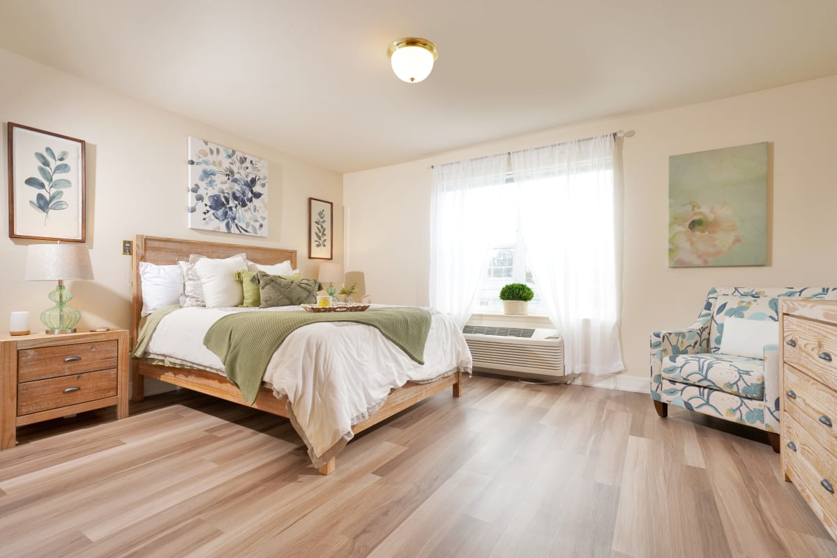 Senior living apartment bedroom at Courtyard at Mount Tabor in Portland, Oregon