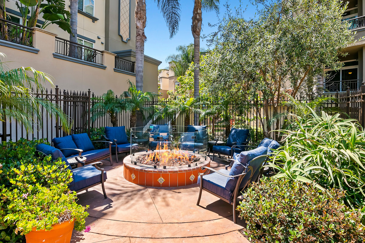 Outdoor firepit with comfy chairs at Playa Del Oro in Los Angeles, California