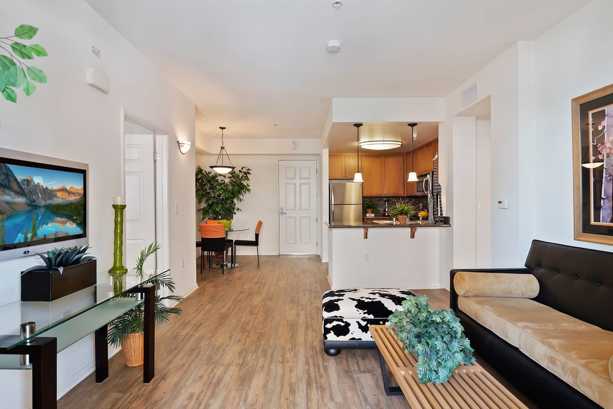 Model apartment with sofa and wood-style floors at The Retreat at Bothell, Bothell, Washington