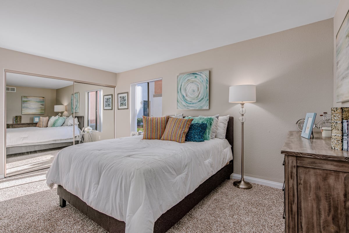 Model bedroom with wall art at Reserve at South Coast in Santa Ana, California