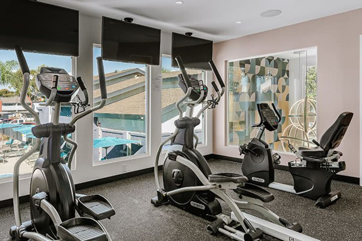 Fitness center with TVs and cardio equipment at Reserve at South Coast in Santa Ana, California