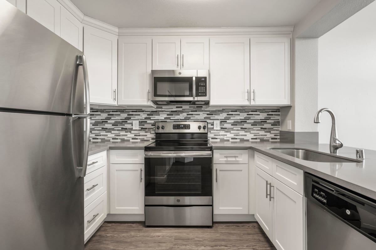 Model kitchen with gray accents at The Bridge at Emeryville in Emeryville, California