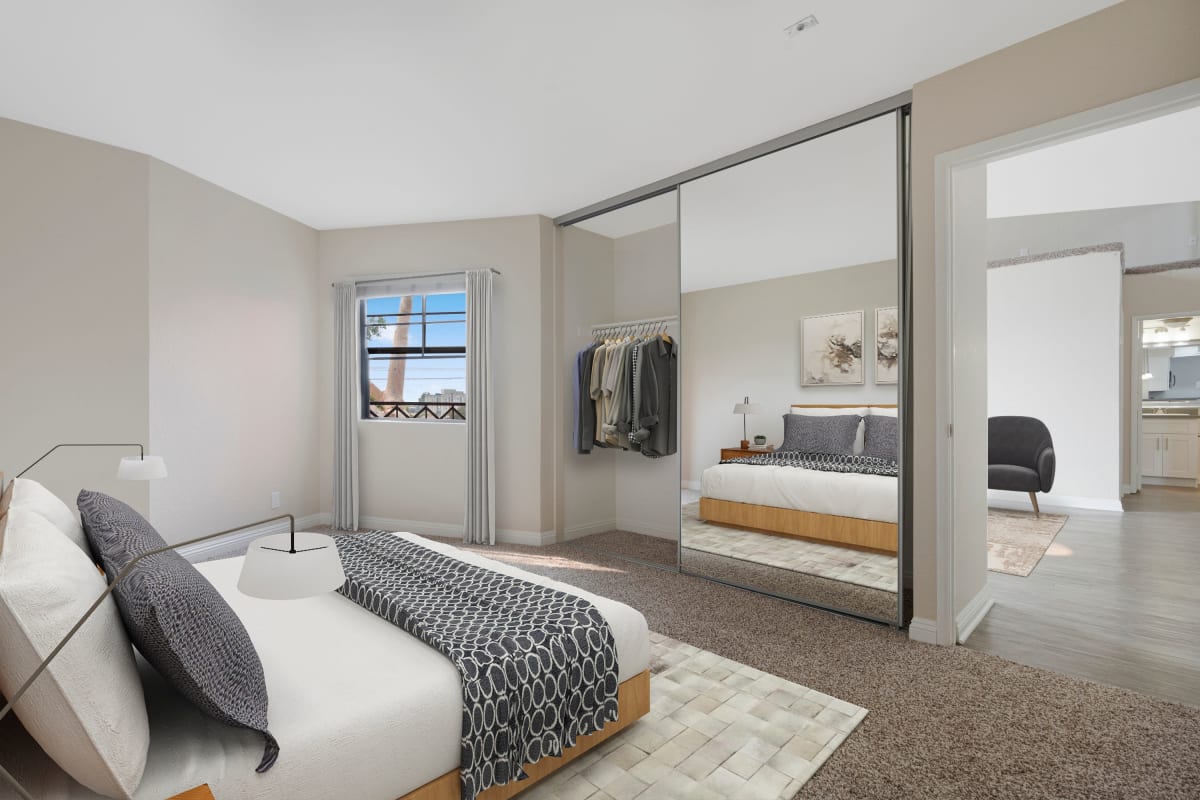 Model bedroom with large mirror at The Jeremy in Los Angeles, California