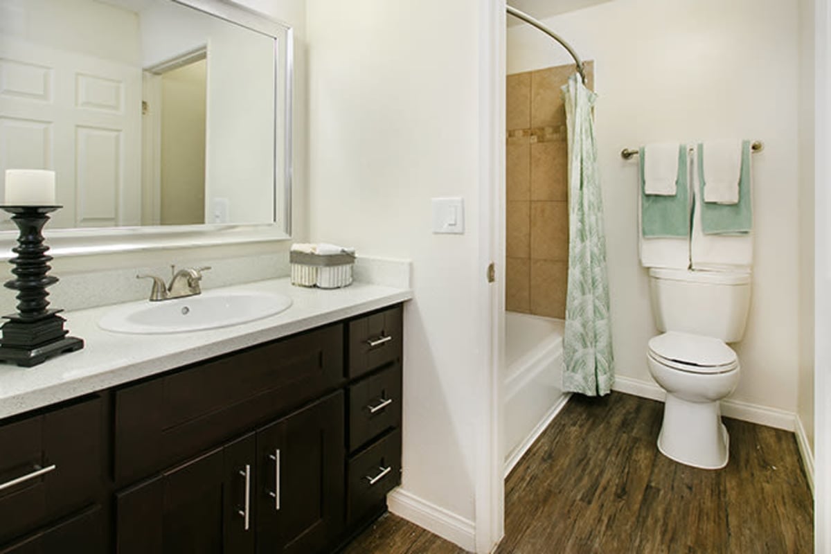 Model bathroom with dark cabinets at Villa Francisca in West Hollywood, California