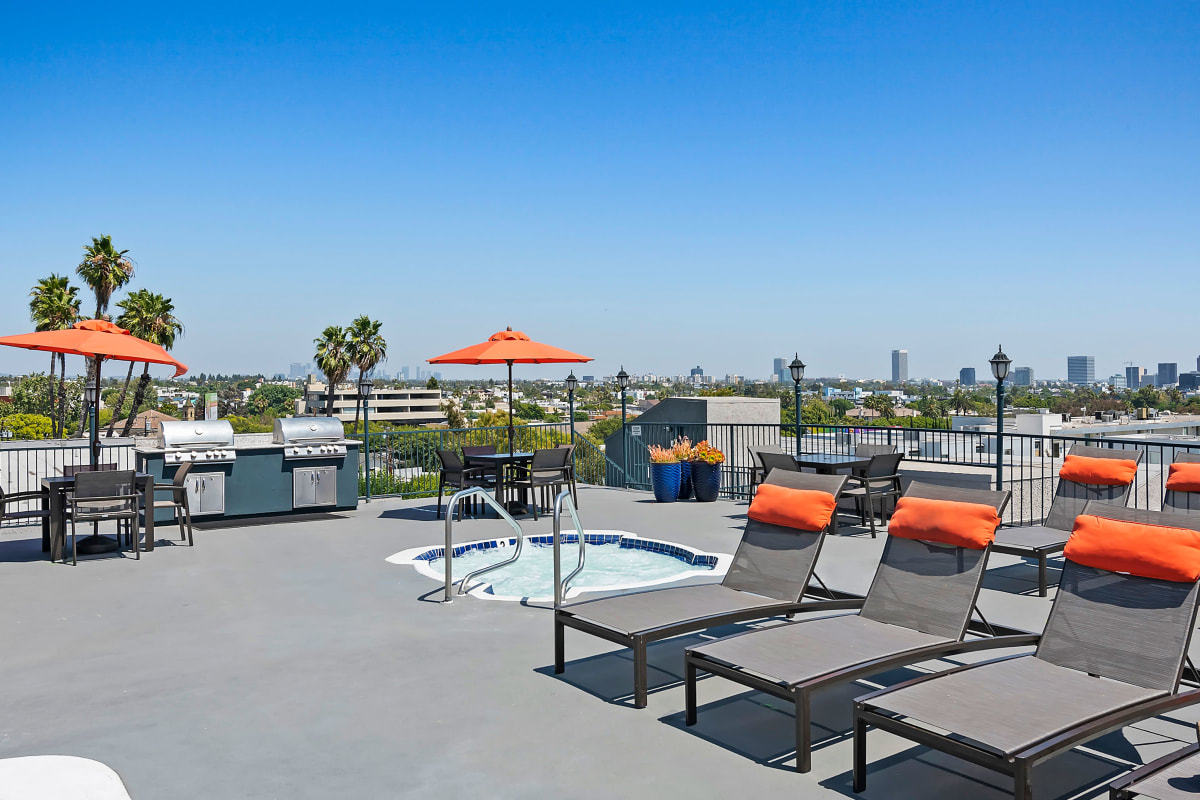 Community pool with lounge chairs at Villa Francisca in West Hollywood, California